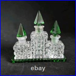 Vintage Czechoslovakian green cut glass perfume bottle set Vintage Czechoslovakian green cut glass perfume bottle set