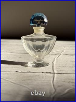 Vintage Guerlain Shalimar crystal perfume bottle with blue stopper